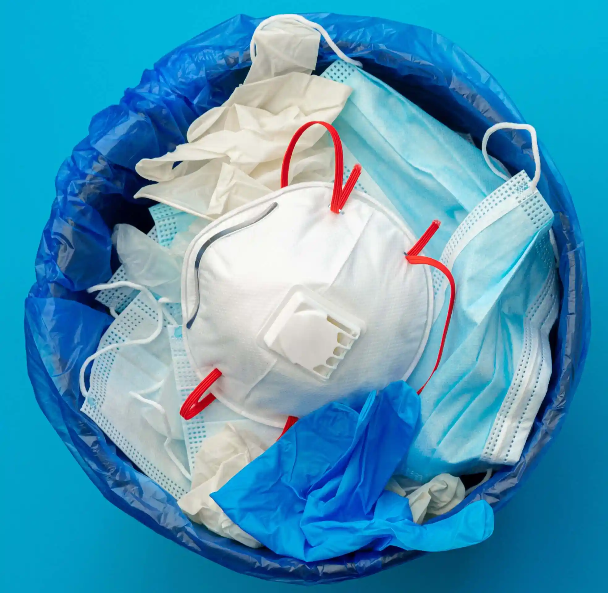 Facemask in trash