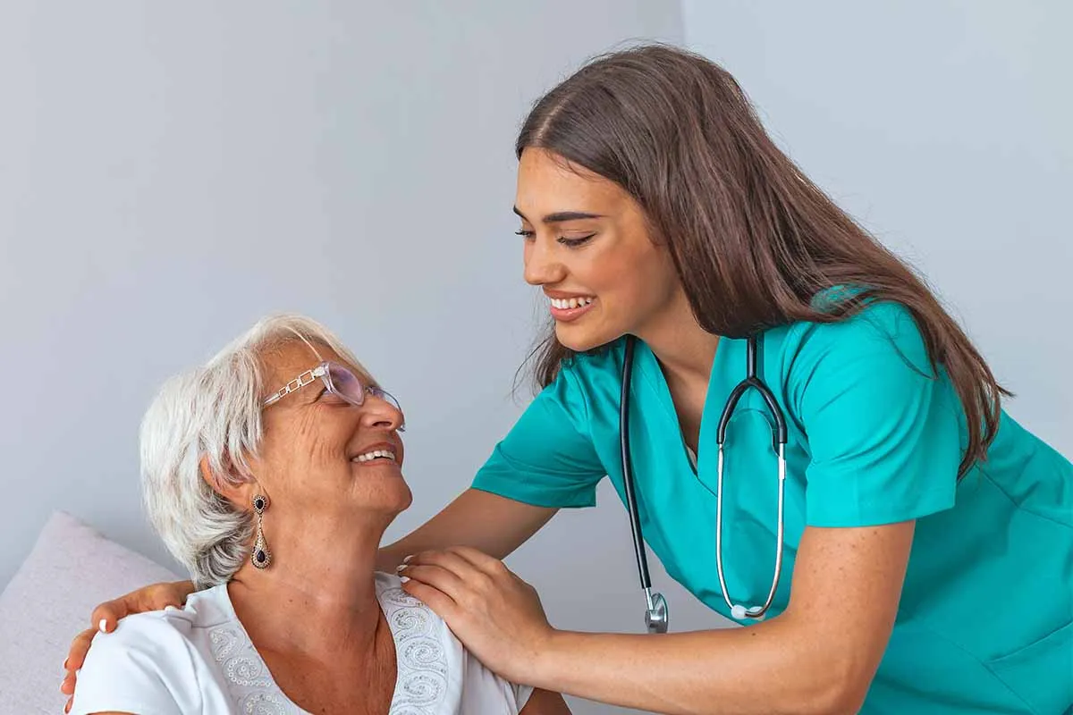nurse helping elder